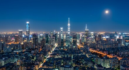 Naklejka premium Panoramic View of a Vibrant Metropolis at Night with Illuminated Skyscrapers and Moon