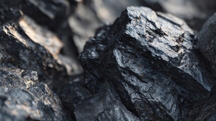 Close up of dark black coal pieces highlighting textures and shapes