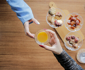 A woman drinking Saudi Arabian coffee