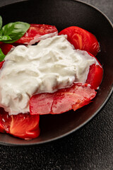 Salad strachatella and tomato portion size natural product tasty snack fresh delicious gourmet food background on the table rustic top view copy space keto and paleo diet
