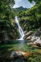 Fototapeta premium Lush Waterfall Cascading into a Crystal-Clear Pool