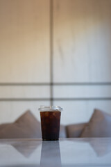 Americano ice coffee on table at coffee shop, ready for drink.