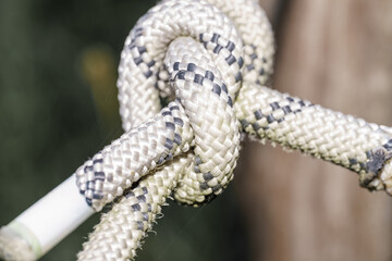 Knot tied using durable rope in an outdoor setting showcasing craftsmanship and strength