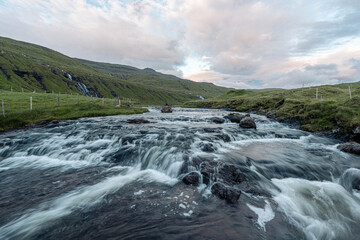 waterfall in the mountains in Faroe Islands