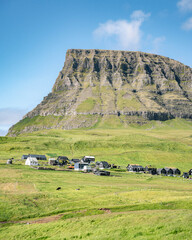 mountain landscape with blue sky and clouds, Faroe Islands, Vagar, Gasadalur village