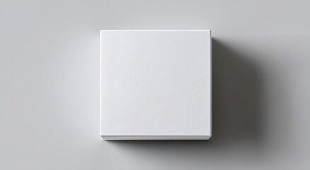 Blank white box on a light gray surface