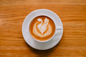 Latte art coffee in a white mug