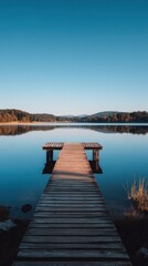 Naklejka premium Single Wooden Dock Extending into Calm Blue Lake under Bright Sunny Sky