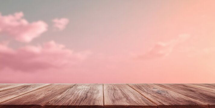 Wooden table top, soft pastel sky background
