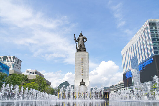 Large bronze statue of a sword-wielding Yi Sun Shin with a water fountain at the base. Seoul, South Korea - 26th August 2025