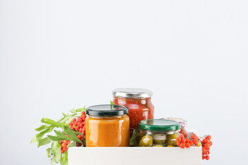 Autumn Gift Box With Homemade Preserves And Pickled Vegetables. Concept Of Seasonal Farm-To-Table Products, Organic Food Hampers, Thanksgiving Ideas, And Local Harvest Branding Visuals