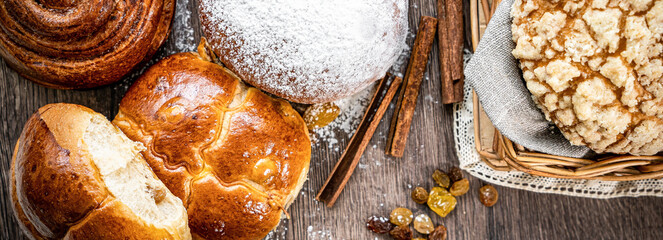 Fresh baked bread, various delicious freshly baked bread on white background, copy space. Variety of artisan bread composition, top view