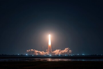 Rocket launch at night over a body of water