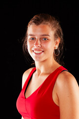 Young and beautiful woman at studio with black backgound