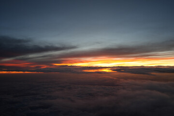 Aerial View From Airplane Window &ndash; September 5 2025: Fiery sunset over clouds seen from a plane window