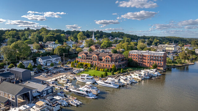 Mystic Connecticut overlooking the scenic Mystic River just south of the Bascule Bridge. Boats, local business, river, and skyline all in high definition beautiful color.