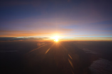 Aerial View From Airplane Window – September 5 2025: Stunning sunset glow over clouds from above
