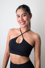 Fototapeta premium Studio portrait of young Asian woman against white background