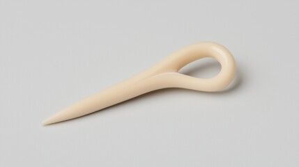 A white toothbrush with a curved handle.