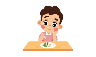 A boy looking uninterested in his meal, sitting at a table with a plate of food in front of him.