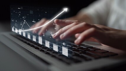 Close-up view of hands typing on a laptop keyboard with a data graph overlay, symbolizing digital...