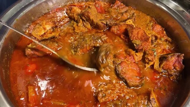 Katla fish curry prepared in Bengali style in an Indian wedding