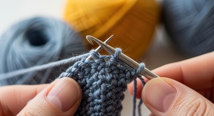 Close-up of knitting hands crafting blue yarn with needles