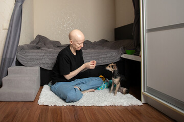 Pet and owner bonding, woman rewarding dog with treat, concept of discipline, emotional wellness...