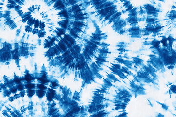 Abstract tie-dye pattern, blue and white color scheme, seamless texture for fabric printing. Background with tie-dye effect in a circular design, high resolution