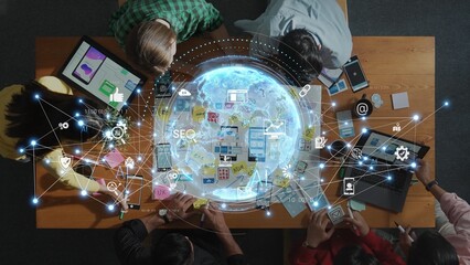 A diverse team collaborates in a modern workspace, integrating technology for digital marketing strategies, featuring various devices and an innovative atmosphere. Raster