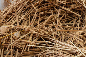 Dusty traditional wood workshop with sawdust pile