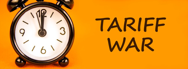 Trade tariff war symbol. Concept word Tariff war on beautiful orange paper. Beautiful black alarm...