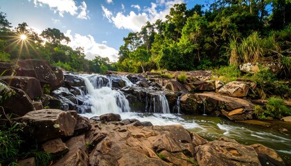 Fototapeta premium Lush waterfall cascading over rocks in a vibrant forest