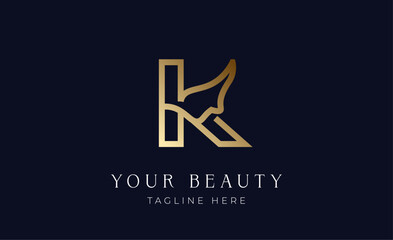 Logo gold colour women face with letter K. Beauty concept with minimalist  modern and luxury brand identity.