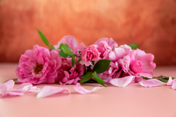 Thank you card among pink flowers on a pastel background