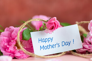 Beautiful bouquet of roses and a thank you note for a gift