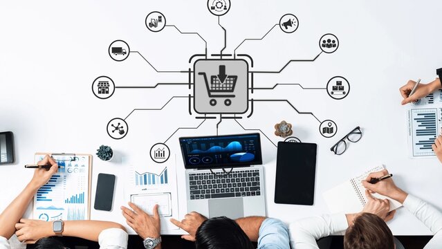 A collaborative workspace illustrating a modern approach to digital marketing for e-commerce, featuring various devices and data analysis elements, highlighting teamwork and strategy. Raster