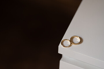 wedding rings on a white table