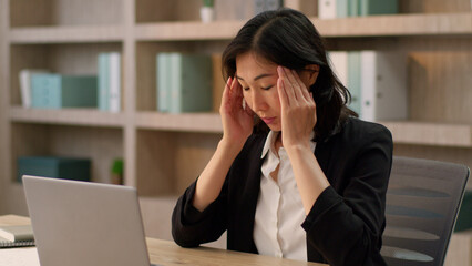 Asian korean woman business worker tired exhausted female adult chinese girl overworked sad online laptop work in office japanese businesswoman feel headache migraine pain head unwell health problem