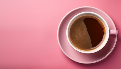 a cup of coffee on a pink background inviting relaxation and enjoyment