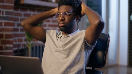 Naklejka premium Businessman ethnic African American business man employer online laptop working deadline night overwork evening office manager tired exhausted worker trouble computer task problem frustrated upset