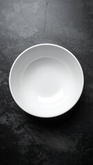 Empty White Bowl on Dark Background Wellness Concept.