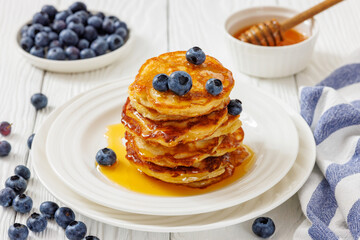 fried hot and crispy pancakes with blueberries