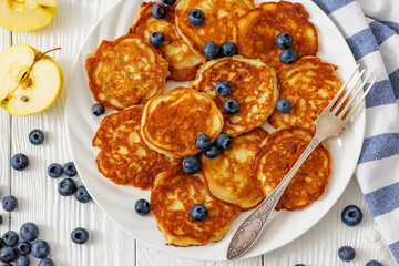 fried hot and crispy pancakes with blueberries