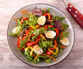 Fresh vegetable and quail eggs salad