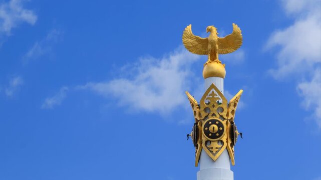 Kazakh Eli independence monument with the blue sky on background.