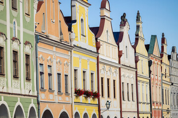 Historical building facades detail with blue sky on background, Telc, Czechia