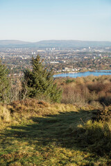 View from the summit of Gleniffer Braes to Stanely Reservoir and beyond to Glasgow in central Scotland  and the distant hills.