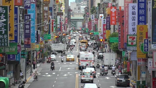 TAIPEI, TAIWAN - AUGUST 2019 : Scenery of street traffic at Datong District. Cityscape of old historical buildings, advertisement billboards of shops and stores along the road.