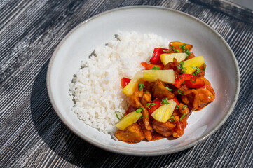 Chicken with pineapple in teriyaki sauce with fried rice. 